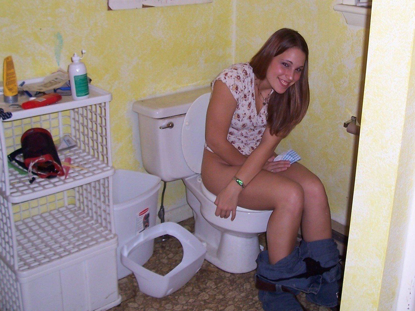 Girls sitting the toilet