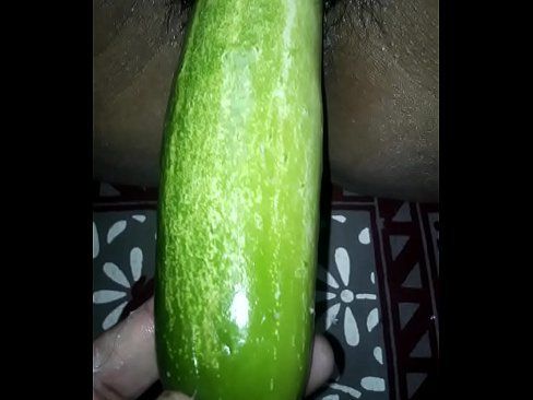 Horny Latina babe fucks a cucumber