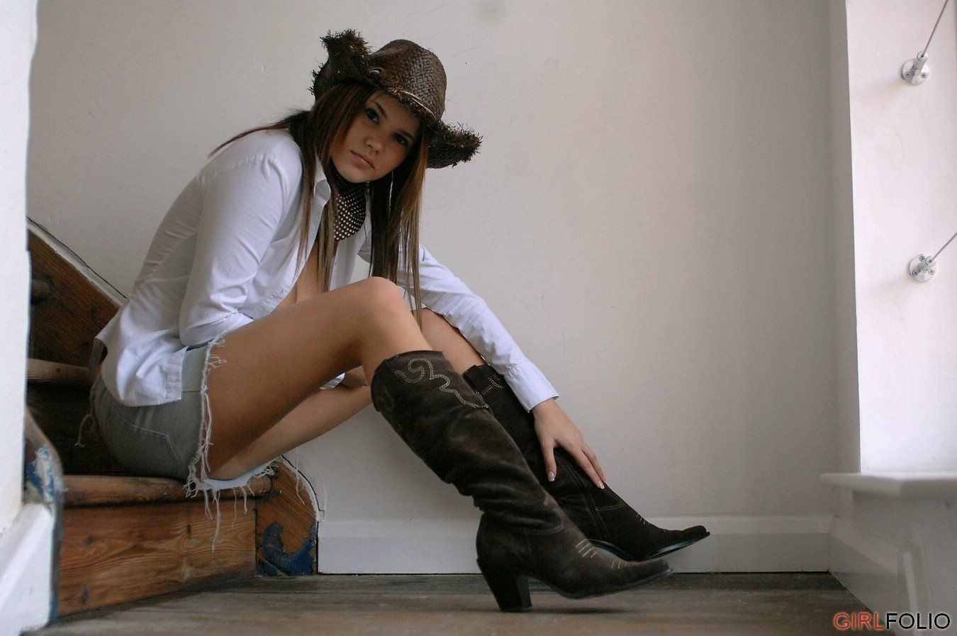 Pretty teen girl wearing boots and white socks.