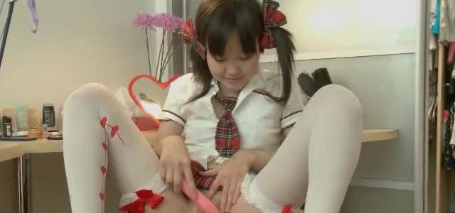 Cute Asian Schoolgirl in Latex Tights.